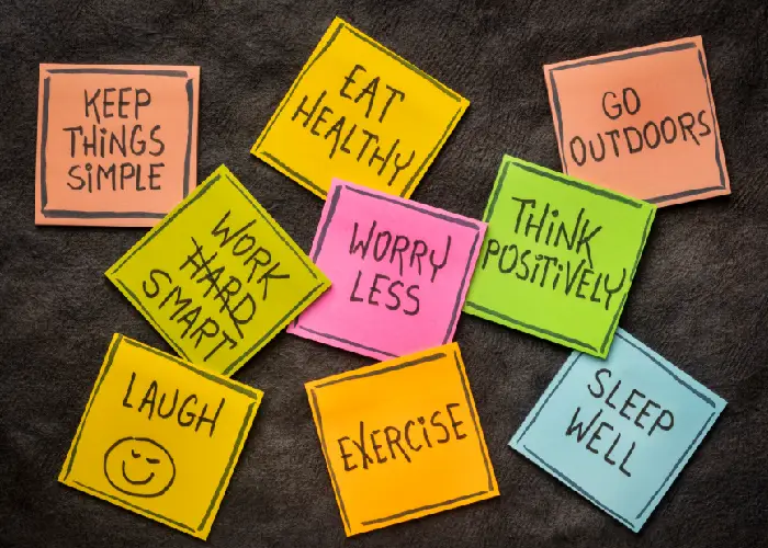 Sticky notes with healthy lifestyle habits like eat healthy, exercise and sleep well